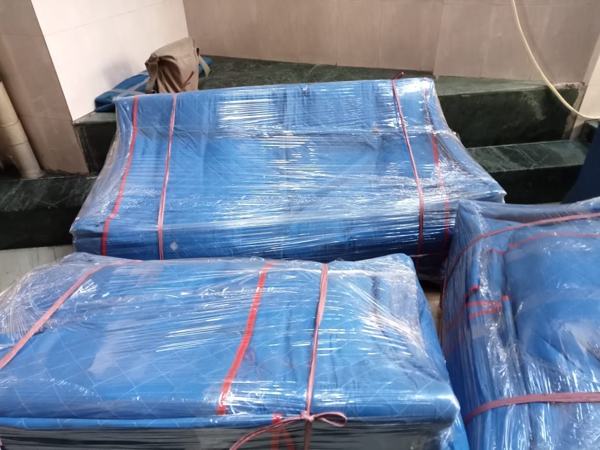 Sofa set protected in blue wrap – packers and movers in Lucknow